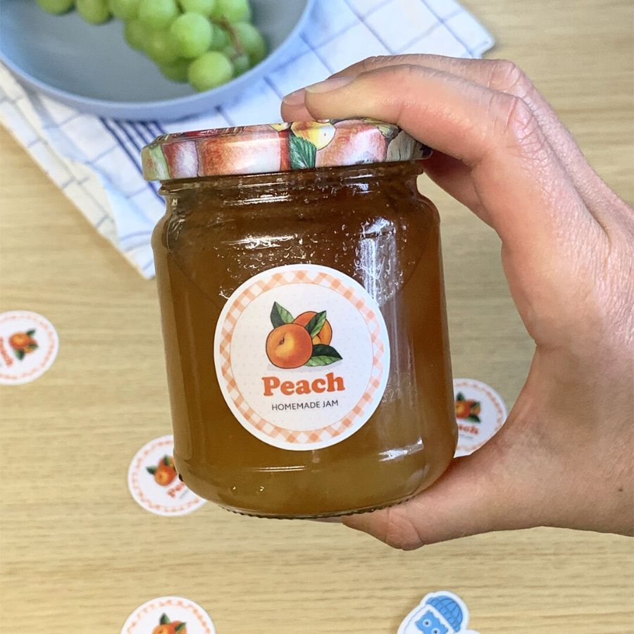 A custom jar label for a homemade Peach jam